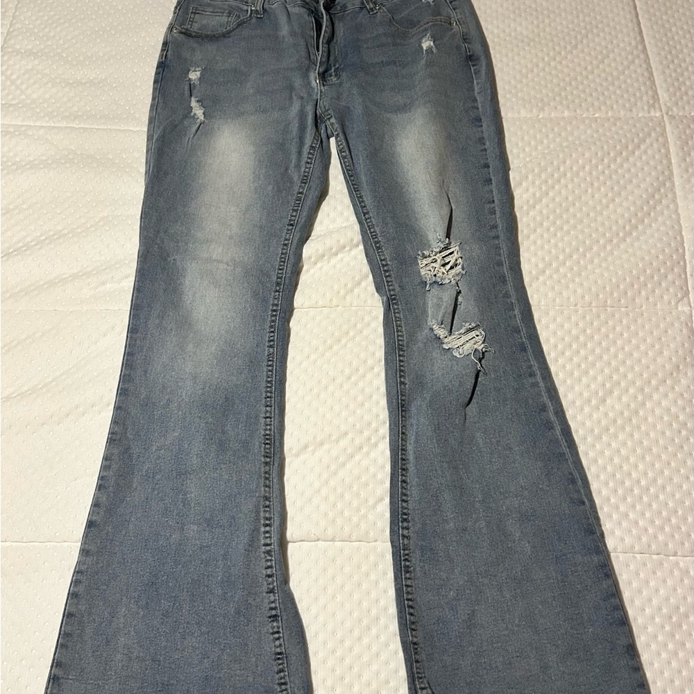 Soft distressed bootcut blue jeans